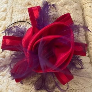 Purple and red fascinator with comb and elastic tie